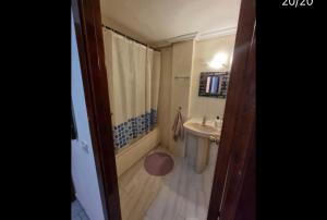 a bathroom with a tub and a sink and a shower at Paris in Alcalá de Henares