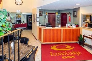 a restaurant with a food counter with a food truck at Econolodge Edson in Edson