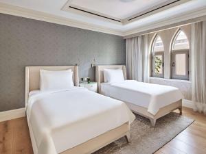 Postel nebo postele na pokoji v ubytování Club Privé By Rixos Saadiyat