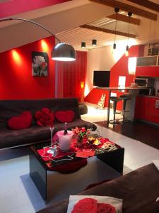 a living room with a couch and a table at Rožu romantika in Cēsis