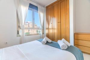 Ένα ή περισσότερα κρεβάτια σε δωμάτιο στο Piso 3 habitaciones plaza de garaje privada y grat
