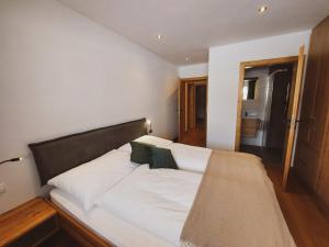 Łóżko lub łóżka w pokoju w obiekcie Appartement Waldplatzl