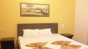 Una cama o camas en una habitación de Darolina Guest House