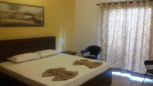 Una cama o camas en una habitación de Darolina Guest House