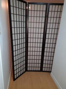 a room with a gate with a wooden floor at Adorable Quiet Open Concept Private Studio Suite in Ajax