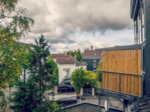 a person standing on a balcony in a city at Serviced Apartement Xanthurus in Schwelm