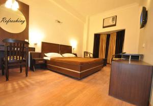 Voodi või voodid majutusasutuse Hotel Hong Kong Inn toas