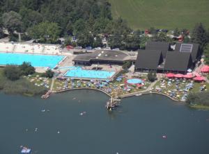 an aerial view of a swimming pool and a resort at Kaufhold Ferienwohnung in Immenstadt im Allgäu