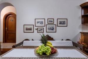 a bowl of fruit on a table in a room at Zoe & Zen Collection in Kampos Paros