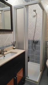 a bathroom with a sink and a shower at Convenient Rooms - Ferry, Train & Bus Station - in Algeciras
