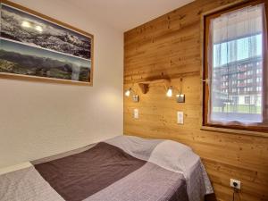 Кровать или кровати в номере Appartement Belle Plagne, 2 pièces, 4 personnes - FR-1-455-90