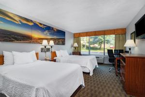 Ένα ή περισσότερα κρεβάτια σε δωμάτιο στο Days Inn by Wyndham Cambridge