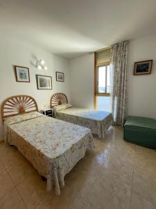 Postel nebo postele na pokoji v ubytování Alpen1 Mediterráneo