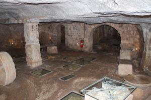 an old room with a fireplace in a cave at Masseria Valente in Ostuni