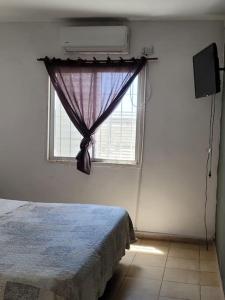 Postel nebo postele na pokoji v ubytování Casa con pileta mirador de cabildo