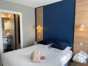 Résidence Hôtelière Natureva & Spa客房内的一张或多张床位