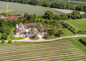 an aerial view of a house and a field at Vineyard View - Hartley Wine Estate 