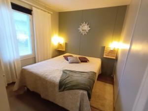 Postel nebo postele na pokoji v ubytování Koivukuja Apartment