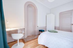 Łóżko lub łóżka w pokoju w obiekcie Grand appartement 8 personnes terrasse privative hyper centre calme