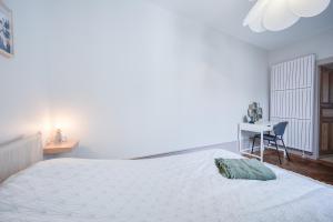 Łóżko lub łóżka w pokoju w obiekcie Grand appartement 8 personnes terrasse privative hyper centre calme