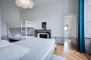 Łóżko lub łóżka w pokoju w obiekcie Grand appartement 8 personnes terrasse privative hyper centre calme