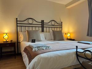 Postel nebo postele na pokoji v ubytování Corzo Hotel