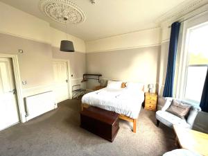 מיטה או מיטות בחדר ב-Melton Guest House