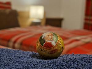 a toy egg with a picture of a man on a bed at Rosy's House Pension Privatzimmer in Bad Goisern