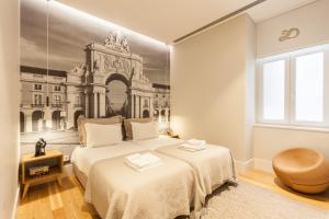 מיטה או מיטות בחדר ב-FLH Baixa Contemporary Flat