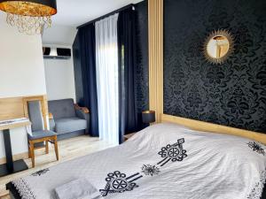 Postel nebo postele na pokoji v ubytování Willa "KomaNcza" Szczawnica