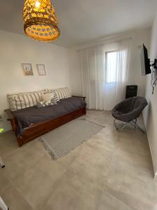a bedroom with a bed and a chair in it at Espacio Edison 1 in Santa Rosa