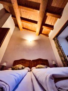 Rúm í herbergi á Albergo Ristorante Selva