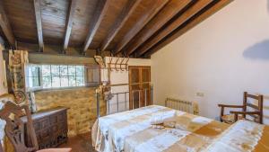 A bed or beds in a room at Casa Molino Algarinejo by Ruralidays