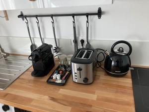 Kuchyň nebo kuchyňský kout v ubytování L'Appartement Vert