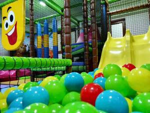 a playground with a bunch of balloons and slides at Kopaonik Zoned 2 in Kopaonik