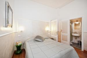 A bed or beds in a room at Romacentrarte