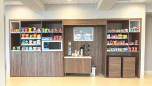 a pharmacyacistacisthibition with wooden cabinets in a room at Holiday Inn Hotel & Suites Chicago - Downtown, an IHG Hotel in Chicago