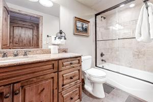 a bathroom with a toilet sink and a shower at Steamboat Resort Villas 608 in Steamboat Springs