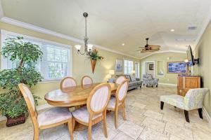 a dining room with a table and chairs at Anna Maria Island Surfside Bungalow in Holmes Beach