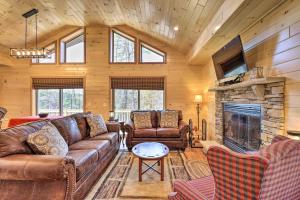 a living room with a couch and a fireplace at Chestertown Hideaway with Lake and Beach Access! in Chestertown
