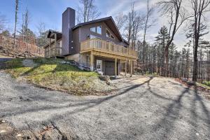 a large house on a hill with a driveway at Chestertown Hideaway with Lake and Beach Access! in Chestertown