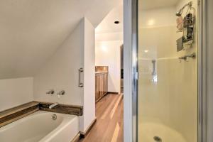 a bathroom with a bath tub and a shower at Nevada City Escape Near Dtwn and Pioneer Park! in Nevada City