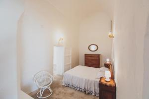 A bed or beds in a room at Masseria La Scalella - Fortificato