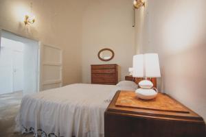 A bed or beds in a room at Masseria La Scalella - Fortificato