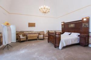 A bed or beds in a room at Masseria La Scalella - Fortificato
