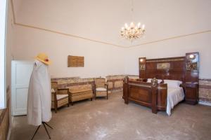 A bed or beds in a room at Masseria La Scalella - Fortificato