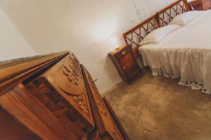 A bed or beds in a room at Masseria La Scalella - Fortificato