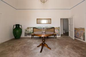 A bed or beds in a room at Masseria La Scalella - Fortificato
