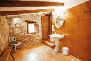 a bathroom with a sink and a mirror at Casa Rural El Callís in Vall de Bianya