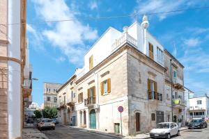 an old building on the side of a street at Palazzo Giannotte Suite & Spa in Ostuni